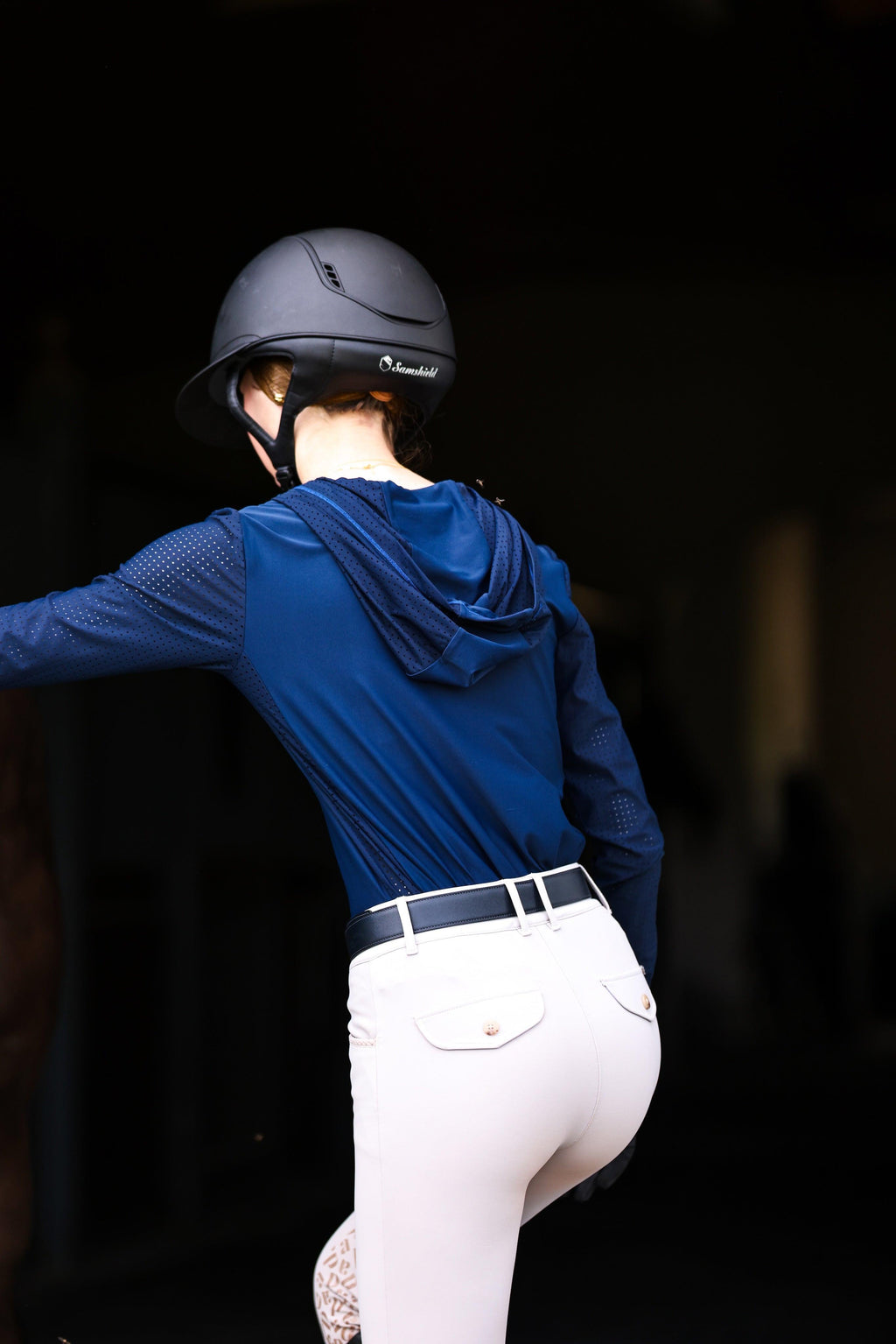 Technical perforated hoodie designed for equestrian enthusiasts, combining style and functionality seamlessly.
