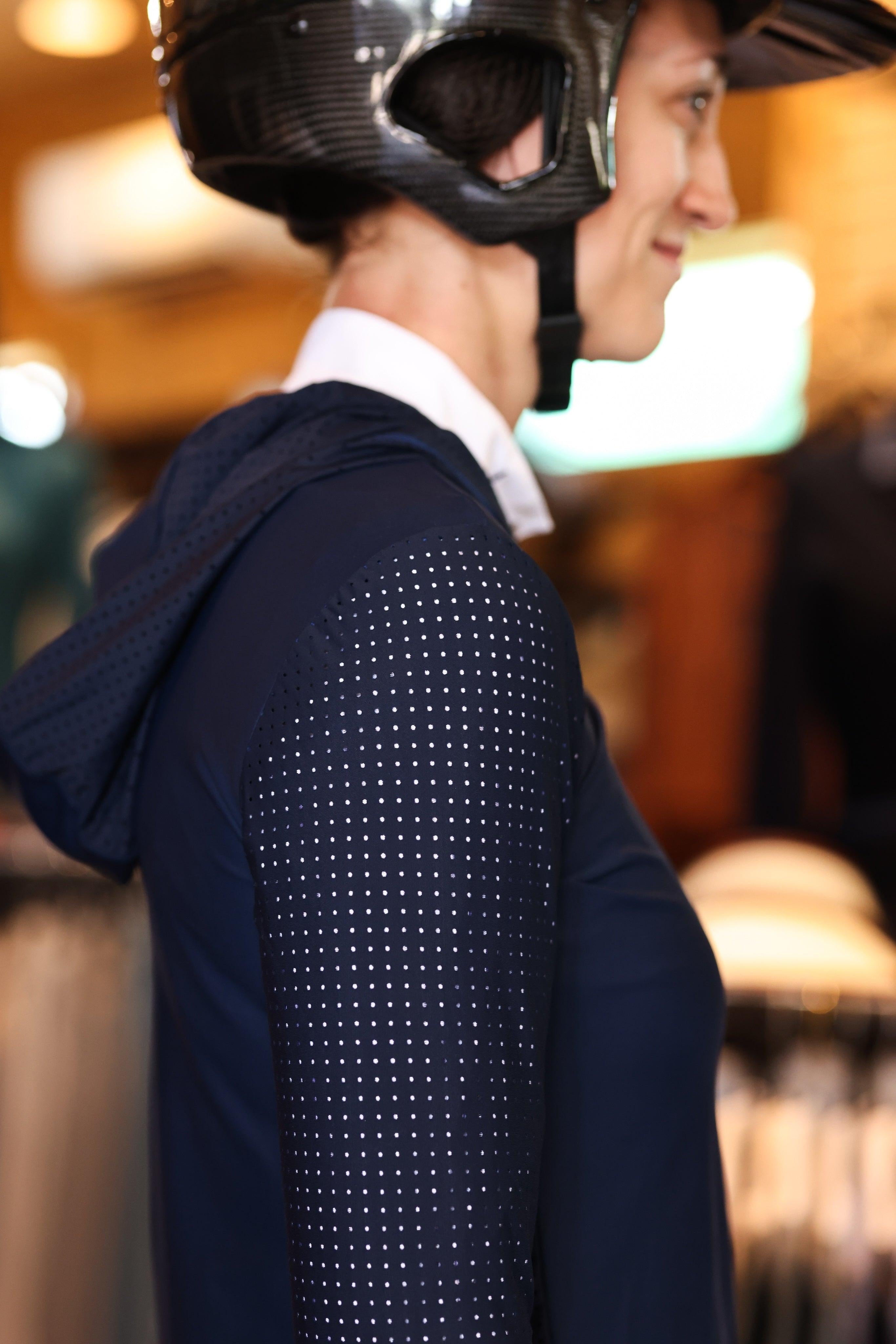 Technical perforated hoodie designed for equestrian enthusiasts, combining style and functionality seamlessly.
