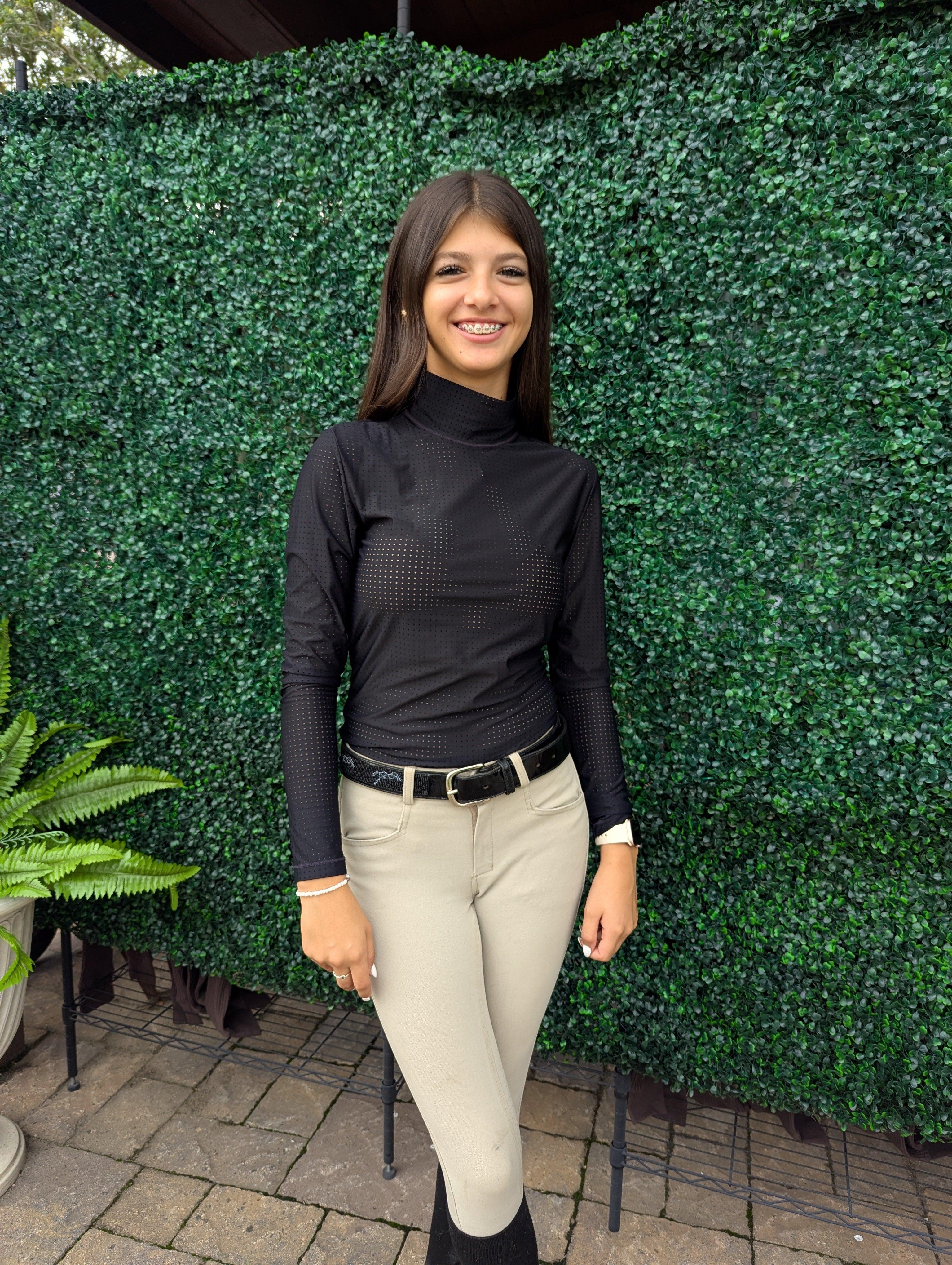 A turtleneck designed for equestrian performance and style